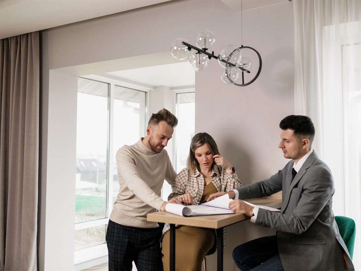 A client signing documents at a table with the mobile notary